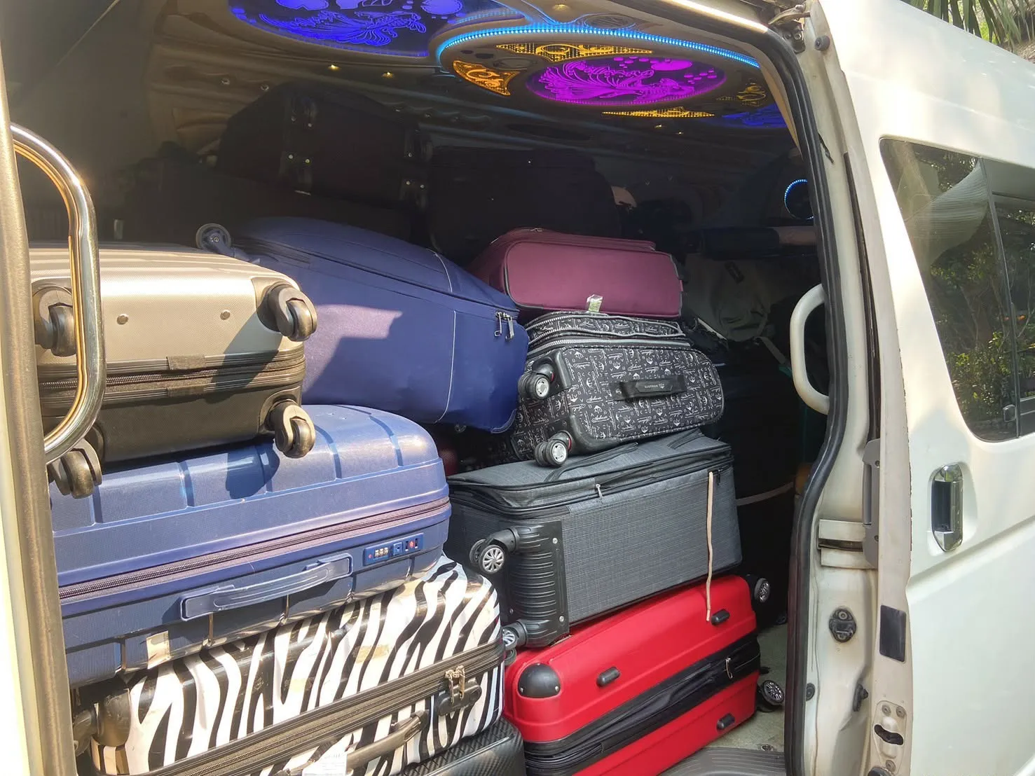 Suitcases stacked inside the van